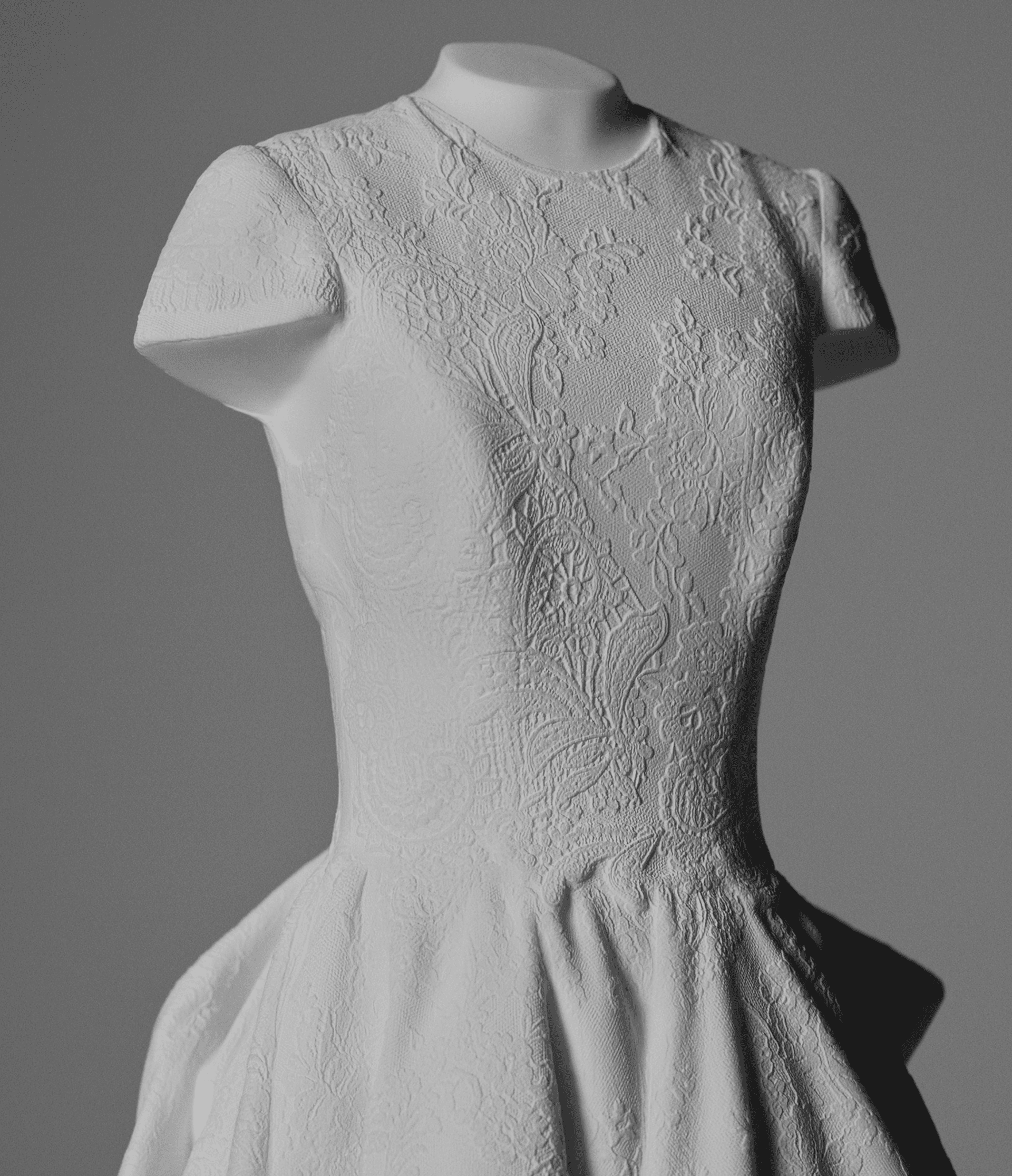 Détail de dentelle brodée d'une robe de mariée